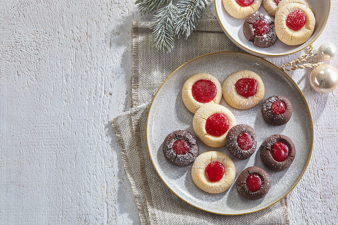 Vanilla and chocolate thumbprints with raspberry jam