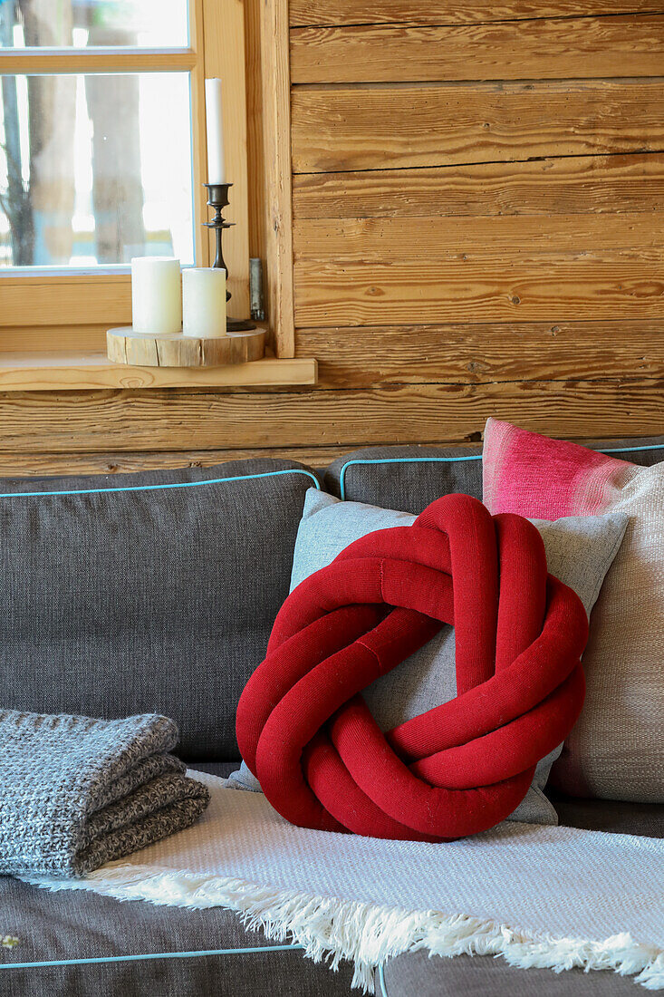 DIY knot cushion on grey sofa