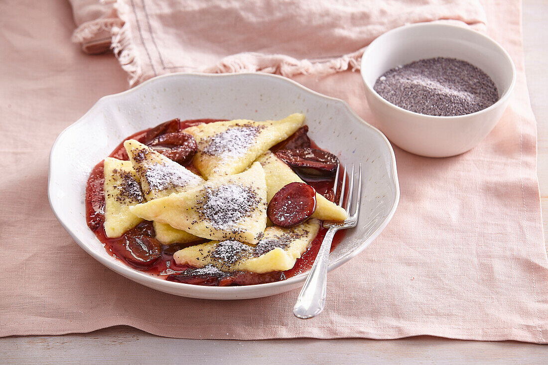 Potato ravioli with plum jam filling and plum sauce