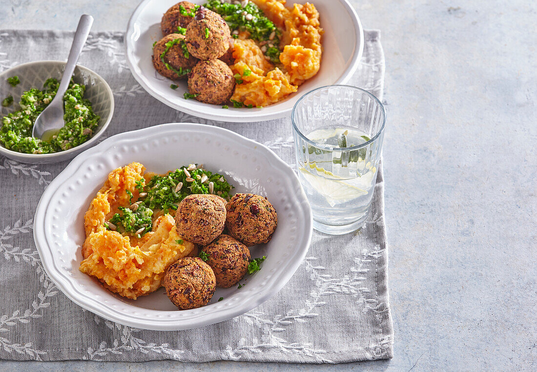 Bean falafels with carrot mash and kale pesto