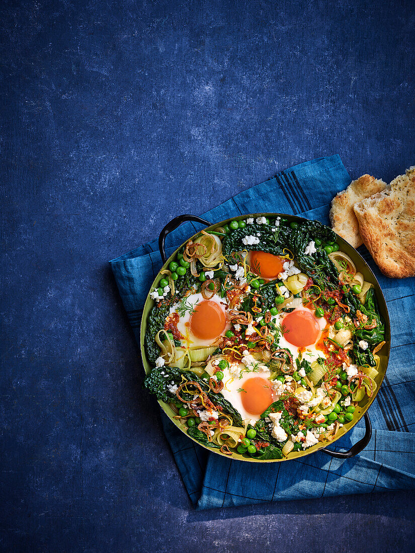 Green shakshuka with harissa and crispy shallots