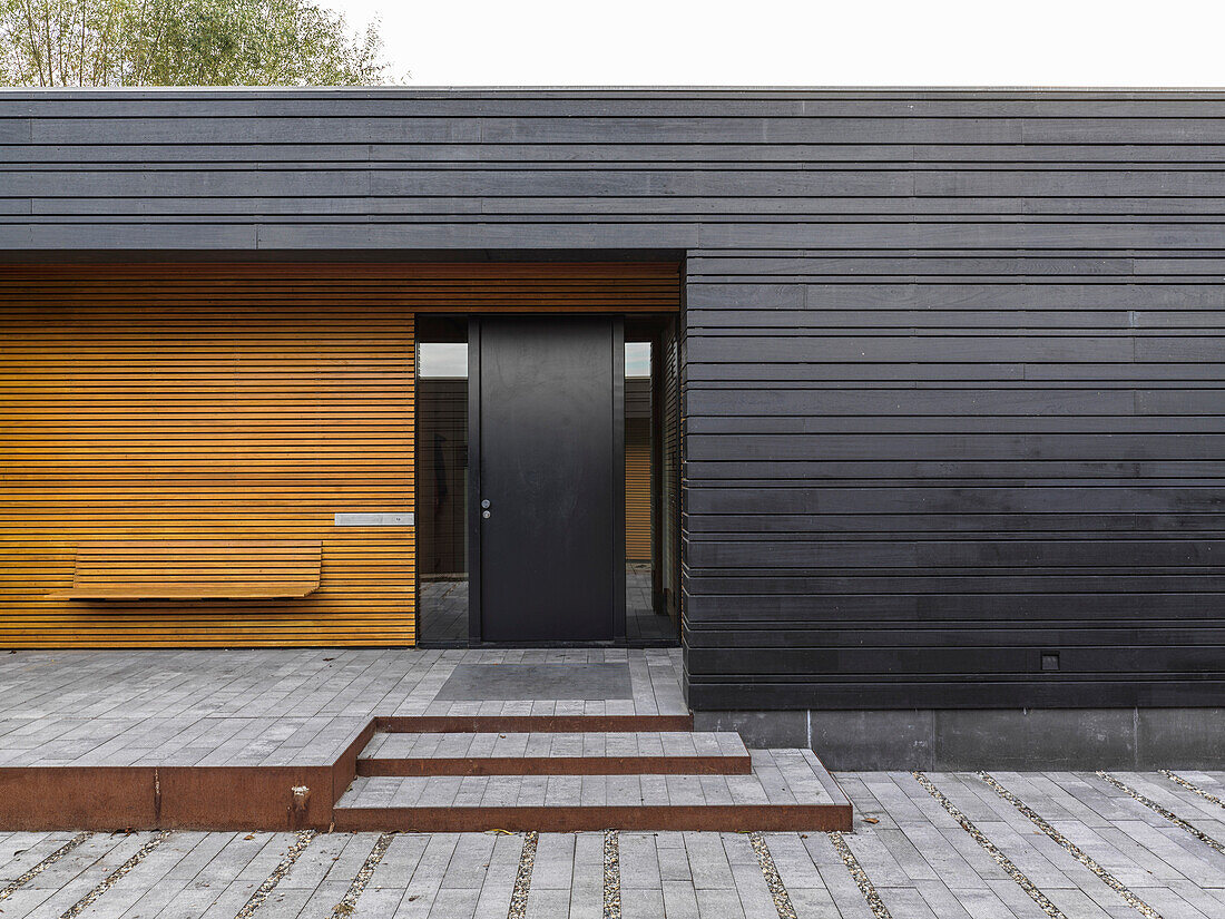 House with wooden paneling, entrance area