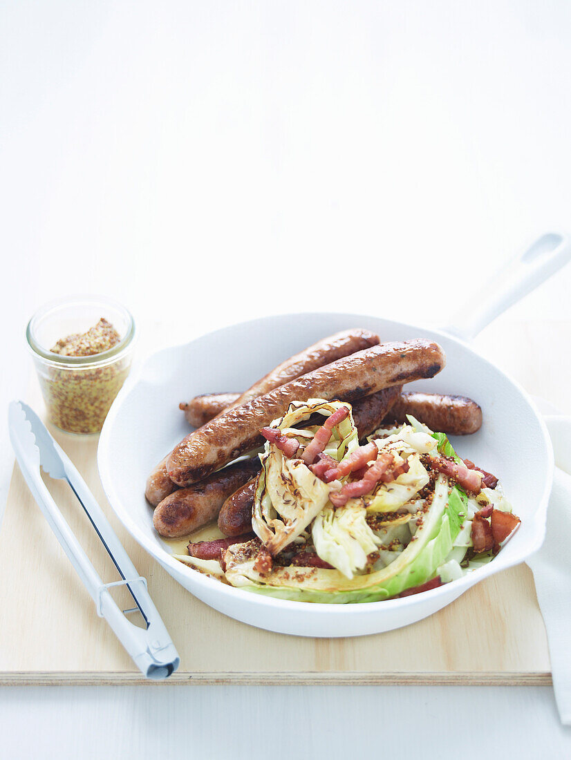Bratwurst with cabbage and bacon