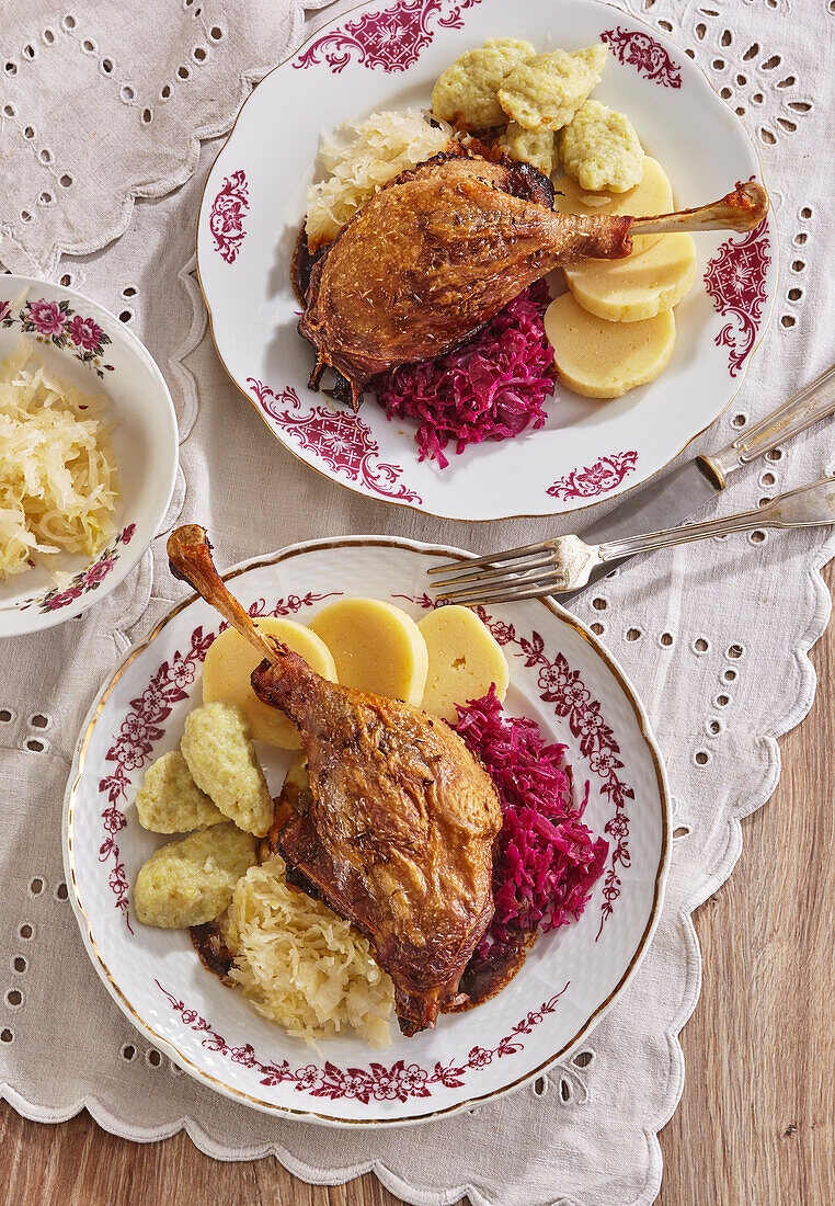 Roasted goose leg with two kinds of cabbage and dumplings