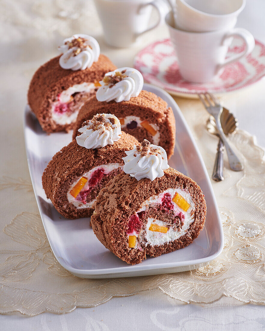 Cocoa sponge cake roll with fruit