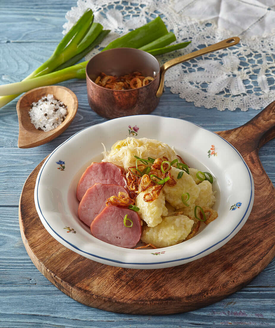 Potato dumplings with smoked pork and sauerkraut