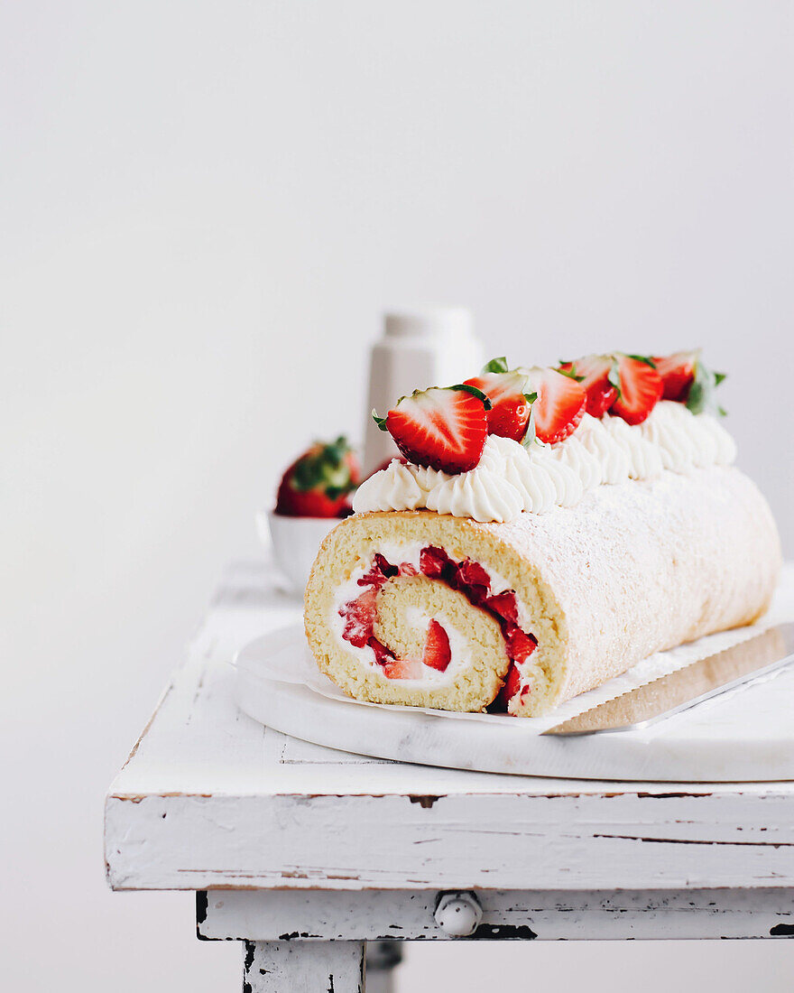 Sponge cake roll with strawberry cream filling