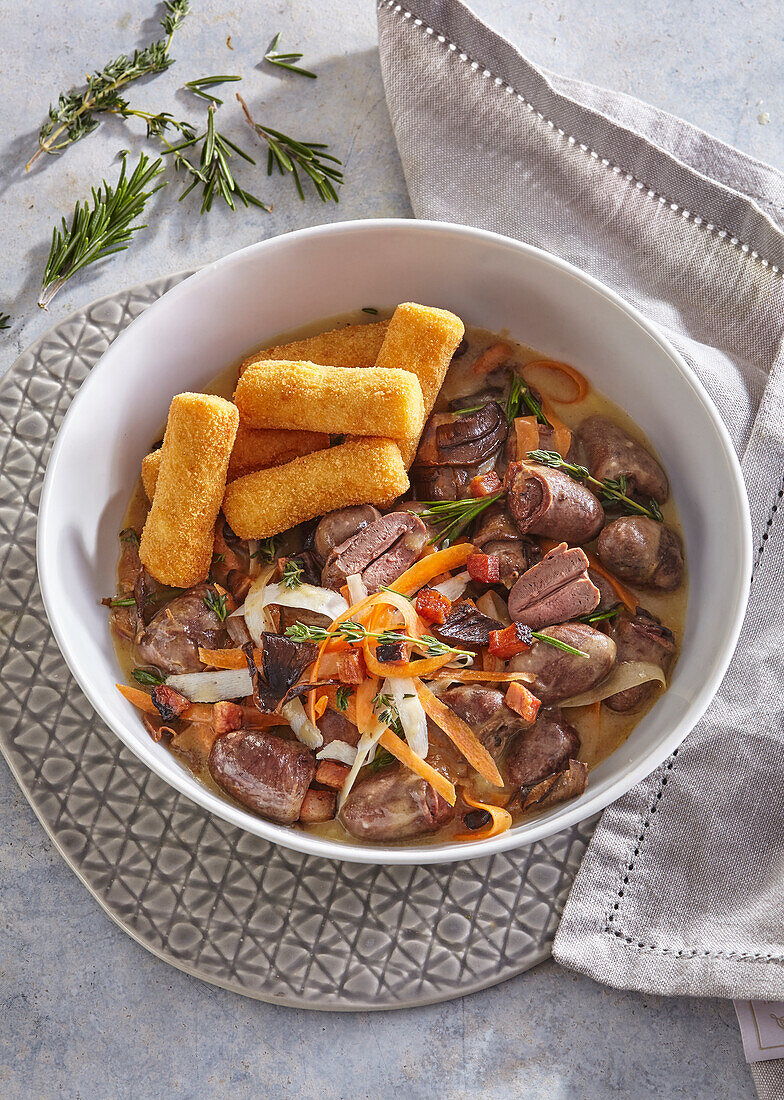 Chicken hearts with mushrooms and potato croquettes