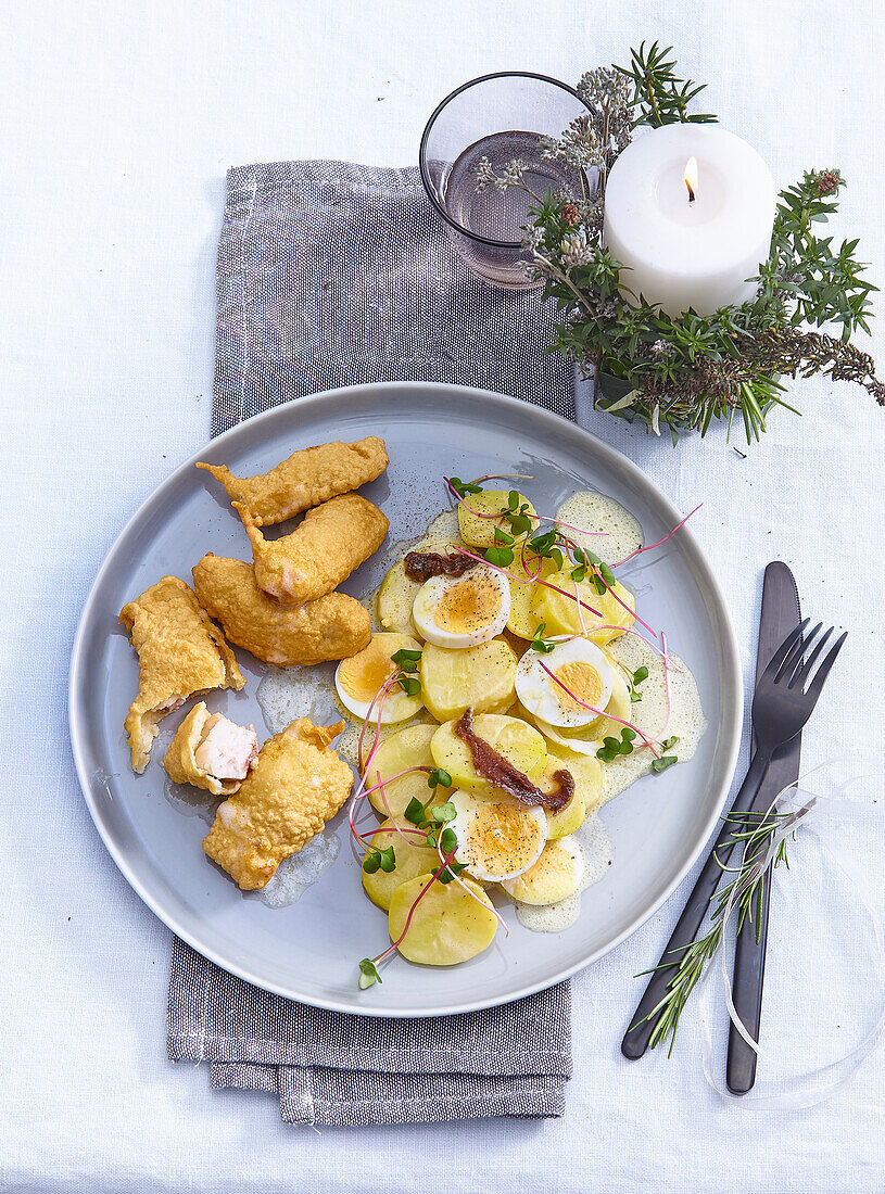 Fish nuggets with potato salad