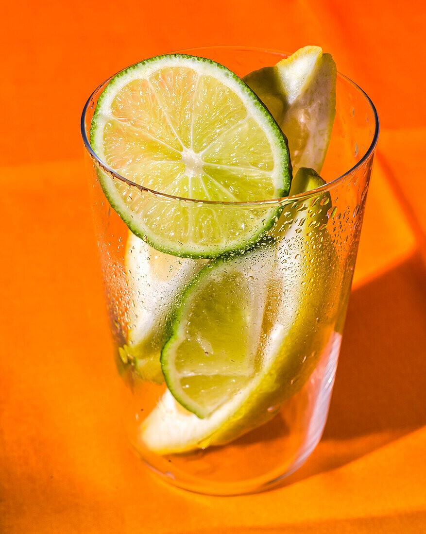 Glass with lemon and lime