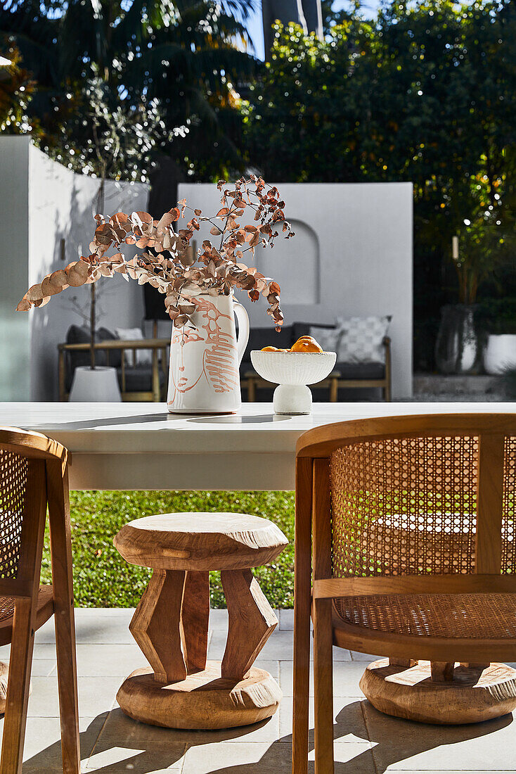 Table with chairs on a sunny terrace