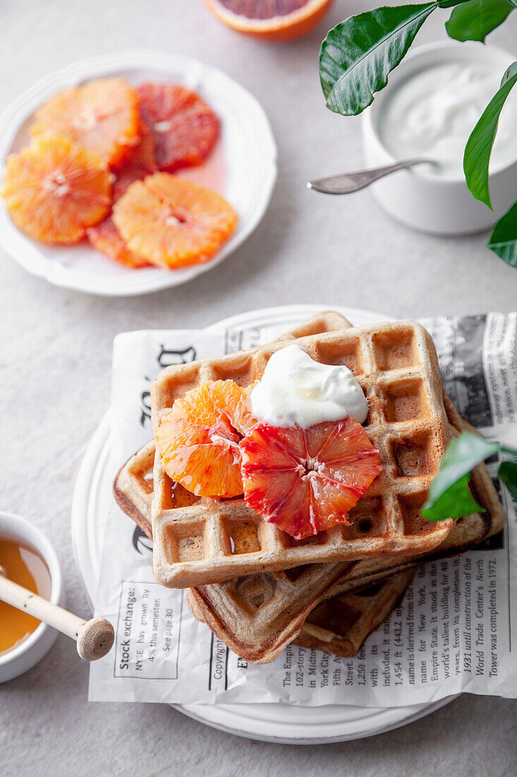 Breakfast waffles with blood oranges, yogurt and honey