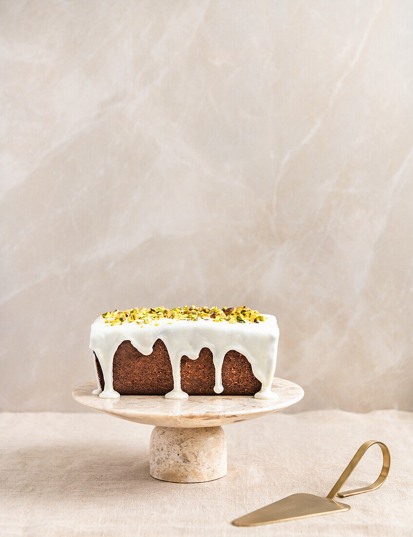 Gluten-free bundt cake with pistachios, lemon and rose petals