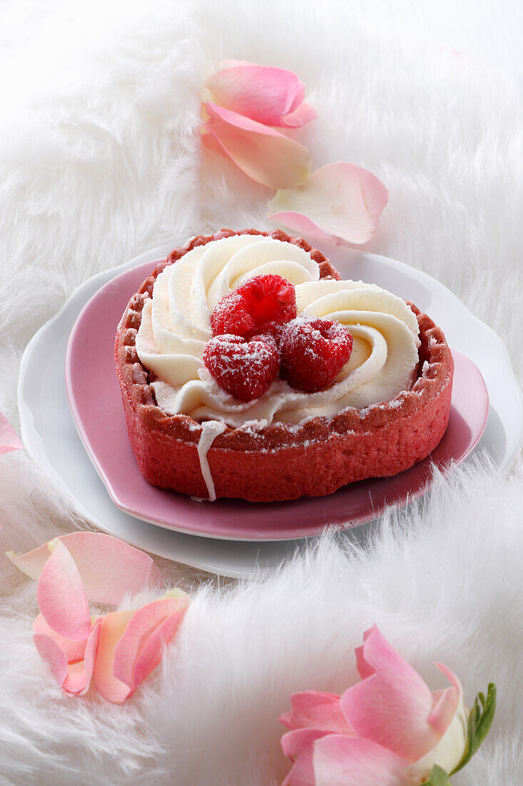 Heart-shaped mini cake with mascarpone and raspberries