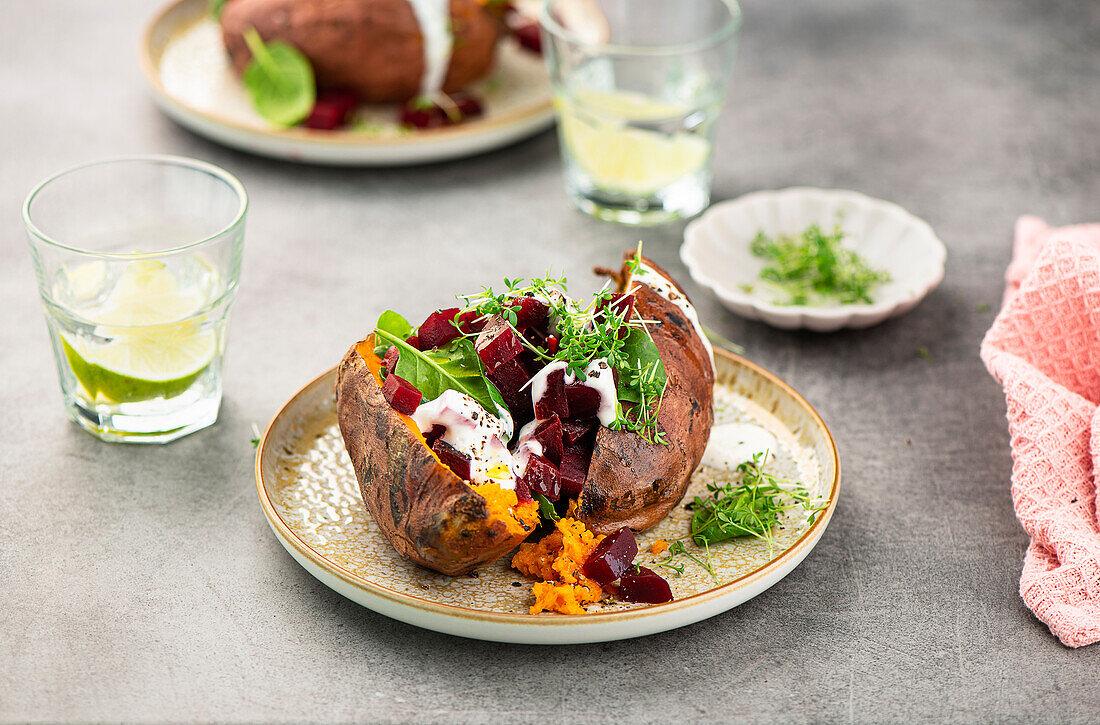 Sweet potato stuffed with beetroot, yogurt and cress