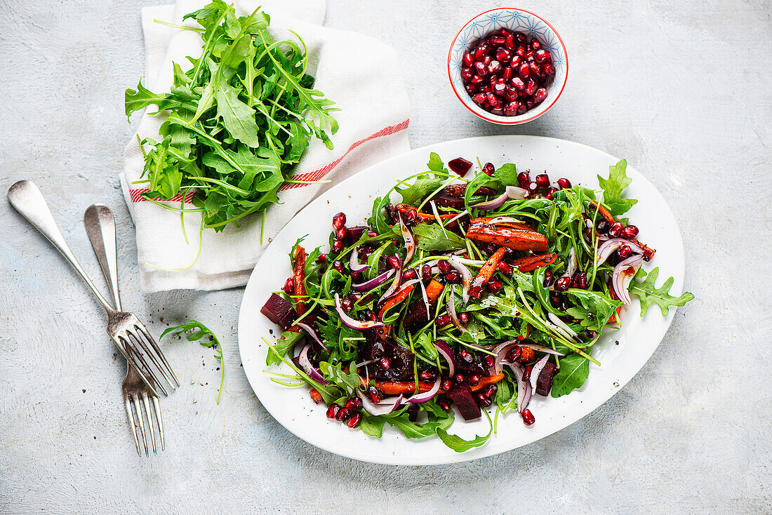 Beetroot salad with roasted carrots and pomegranate seeds