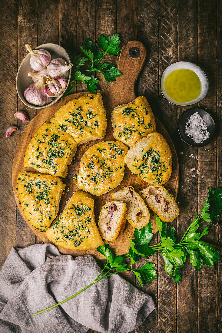 Focaccia bread with garlic, olives and parsley