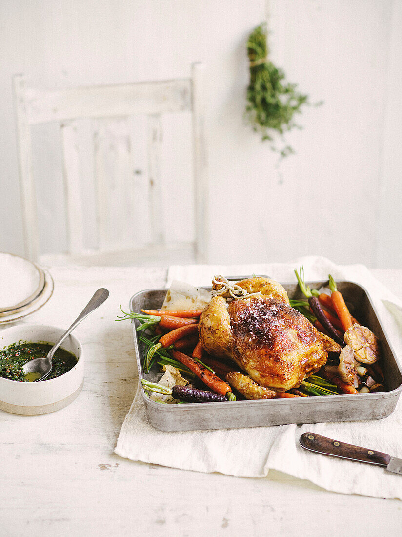 Humble roast chicken with carrots and herb sauce