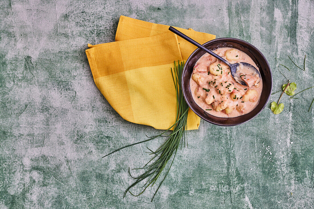 Meat sausage stew with gnocchi