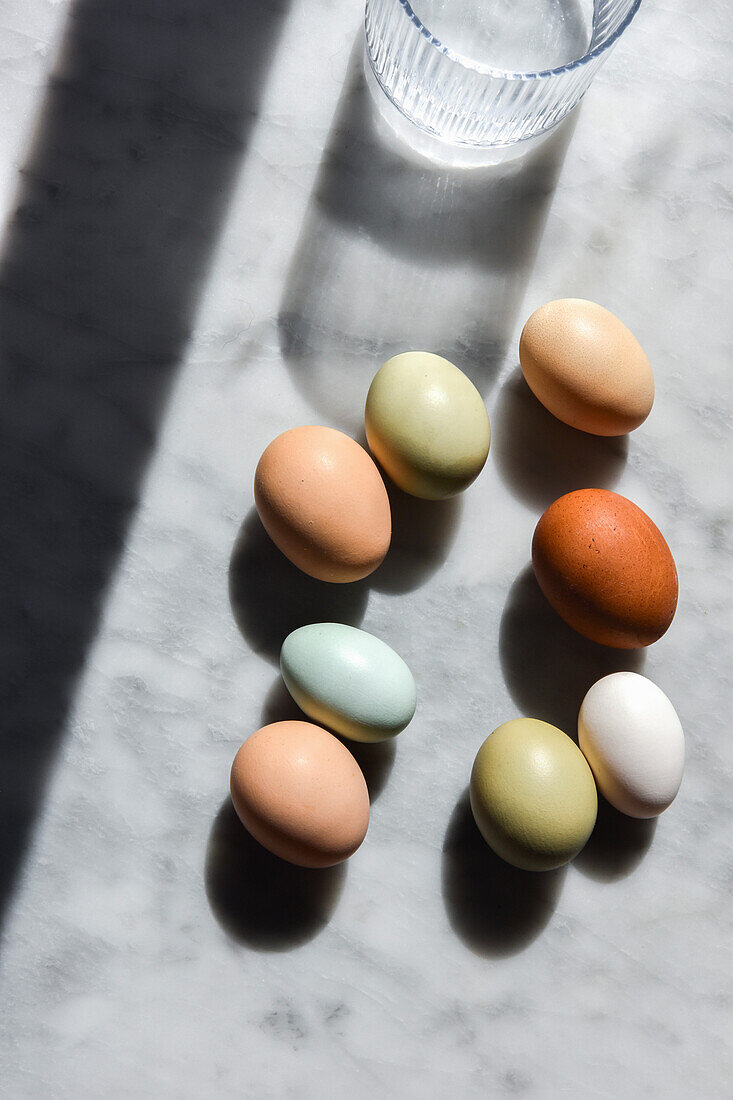 Naturally colored eggs on a marble background