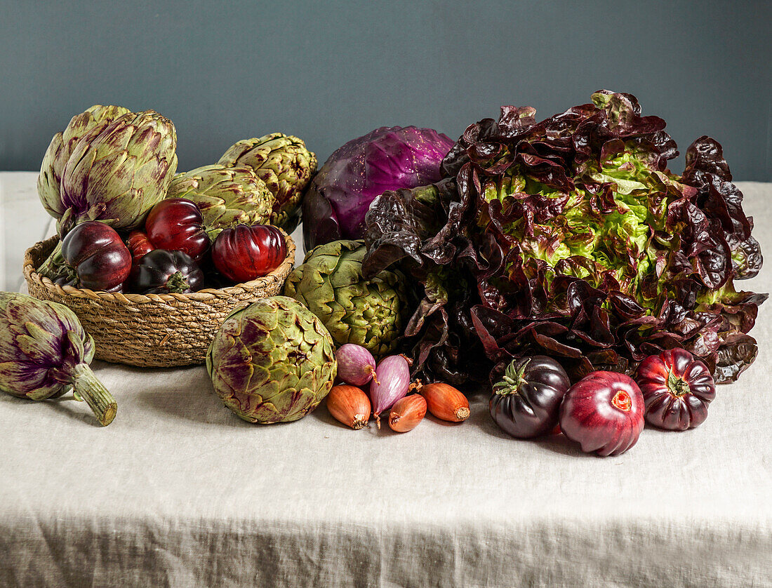 Purple vegetables (purple artichokes, tomatoes, onions, lettuce)