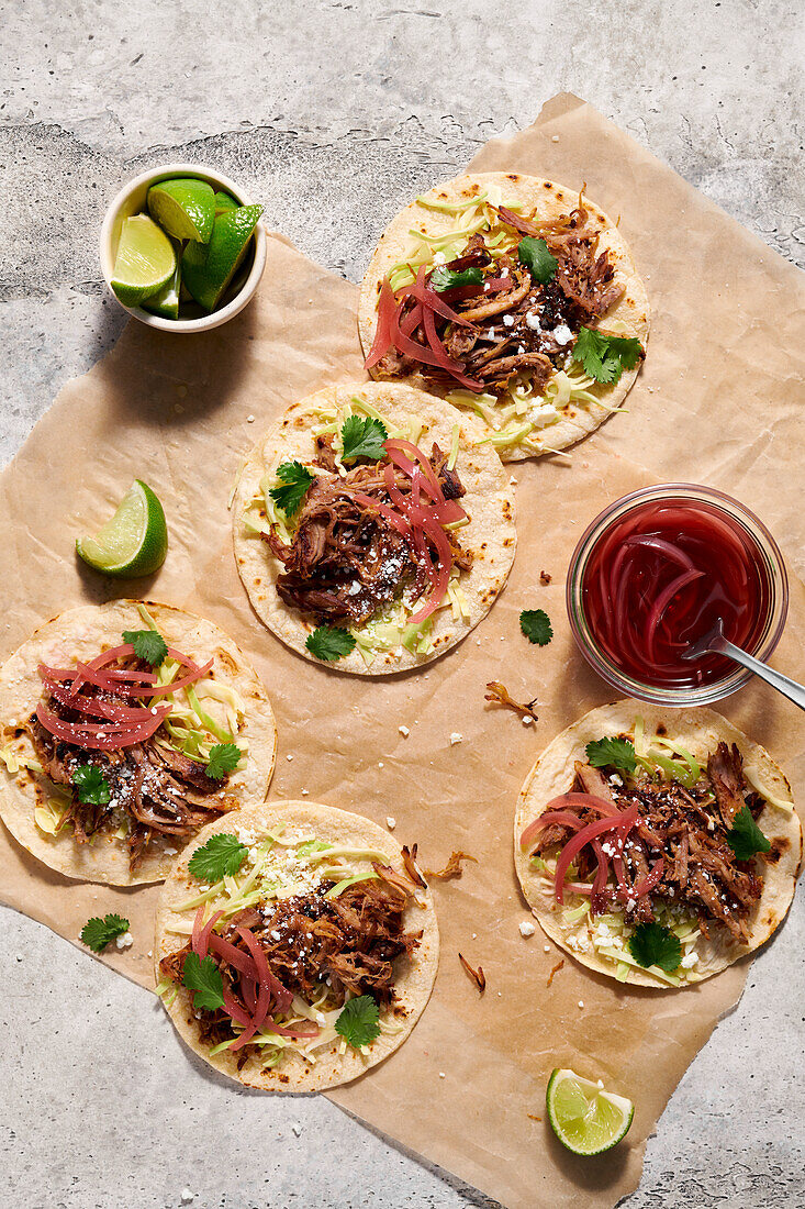 Pork tacos with pickled red onions