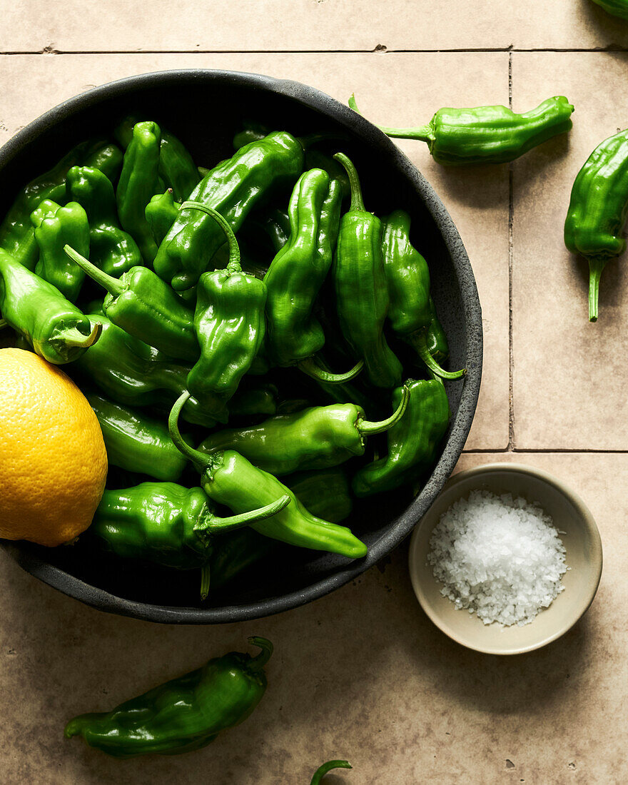 Raw Shishito peppers in a bowl