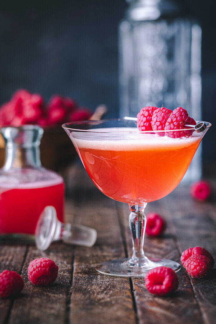 Raspberry Cocktail with fresh raspberry garnish and raspberry syrup