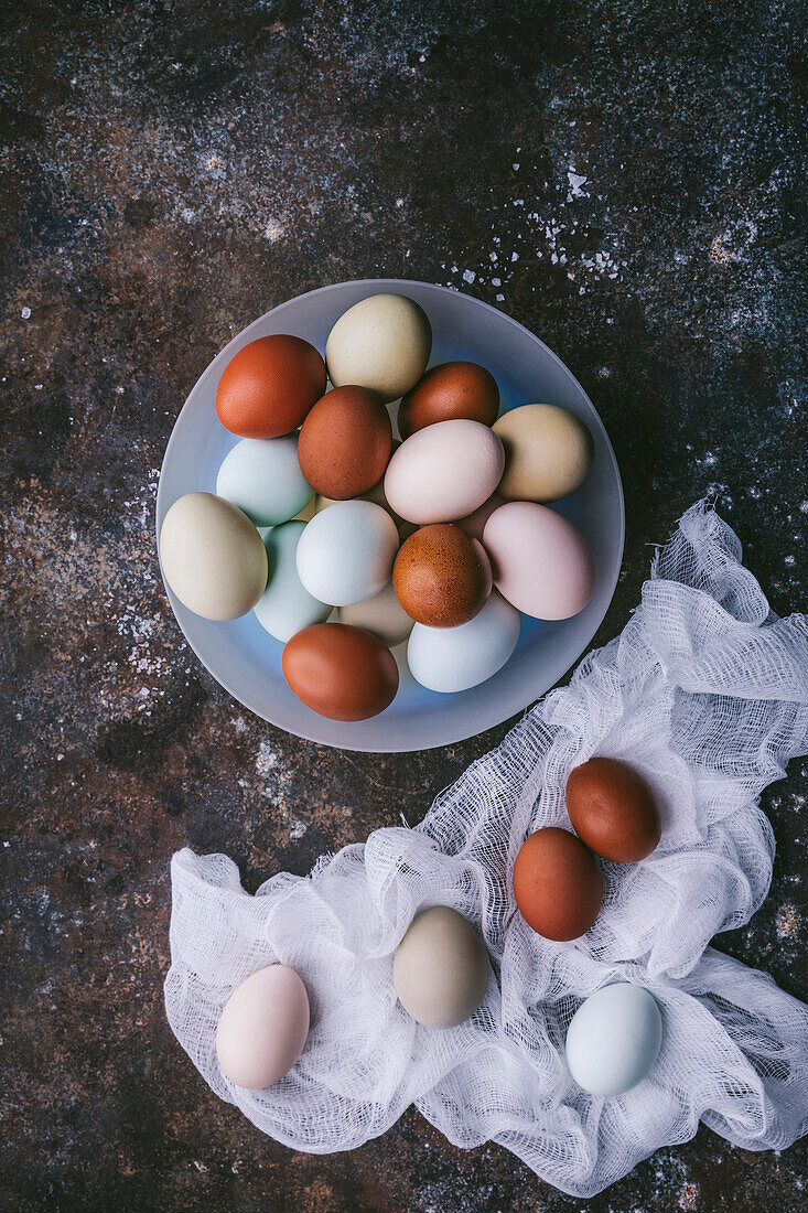 Naturally colored eggs in a bowl