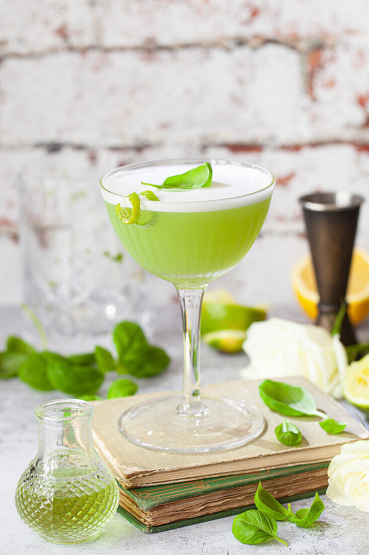 Gin cocktail with basil, lime and egg white foam