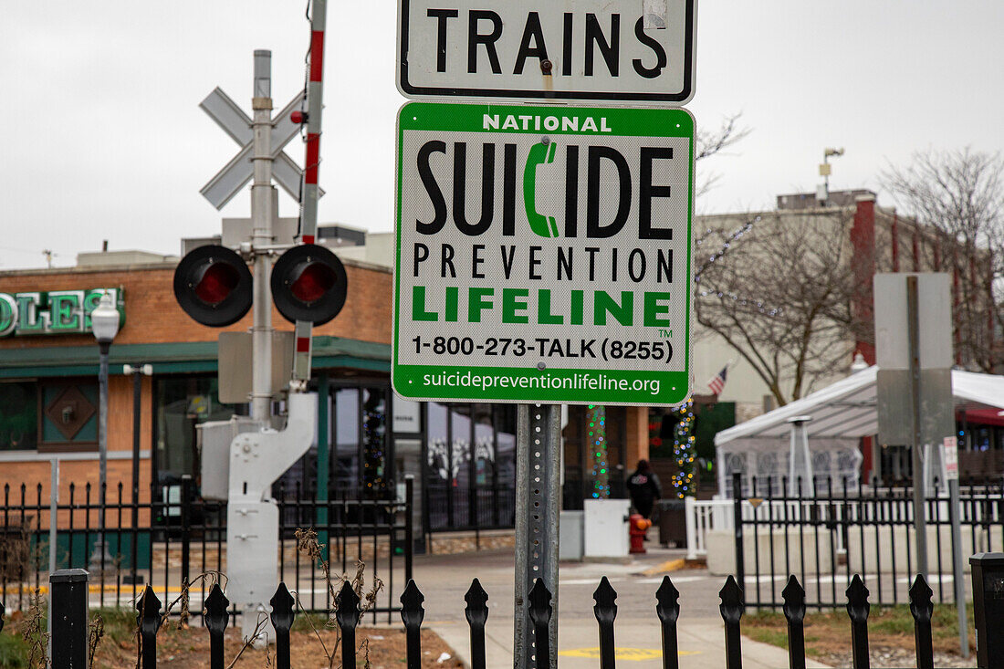 Suicide prevention sign at railroad crossing