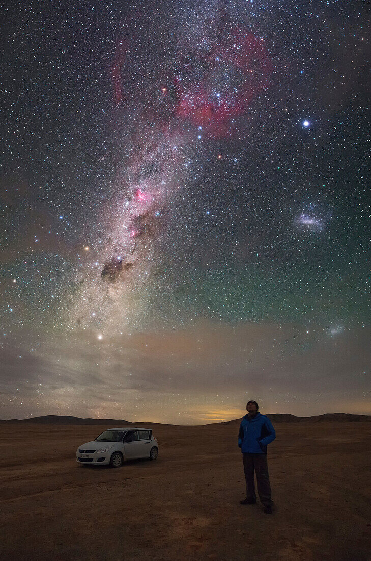 Man staring at the night sky, Atacama Desert, Chile