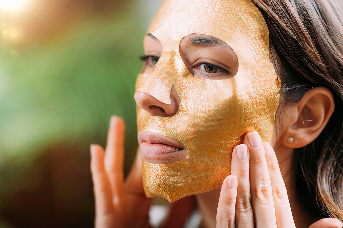 Gold face mask treatment