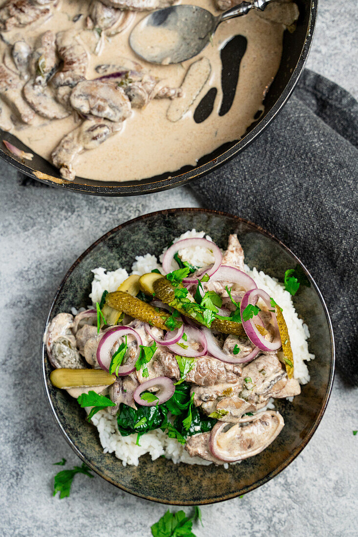 Beef stew Stroganoff style with onions and gherkins