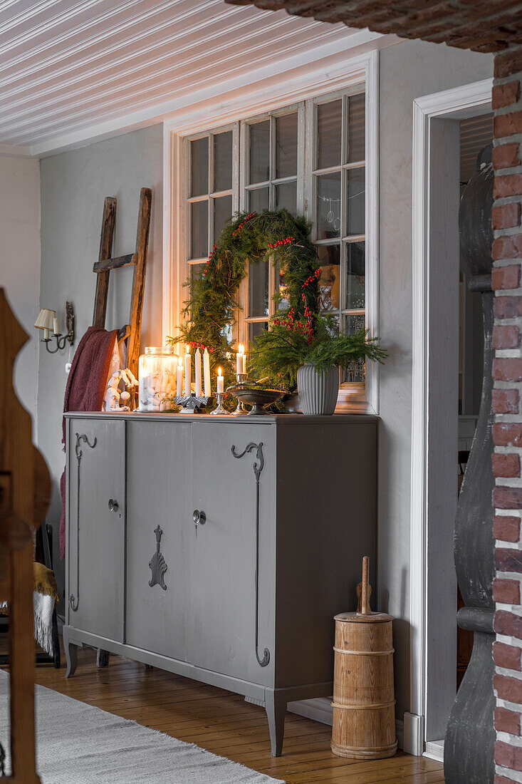 Cupboard with country-style Christmas decorations