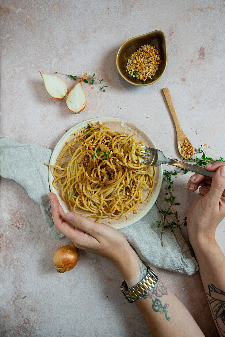 Pasta with braised miso onions with crunchy crumbs and thyme