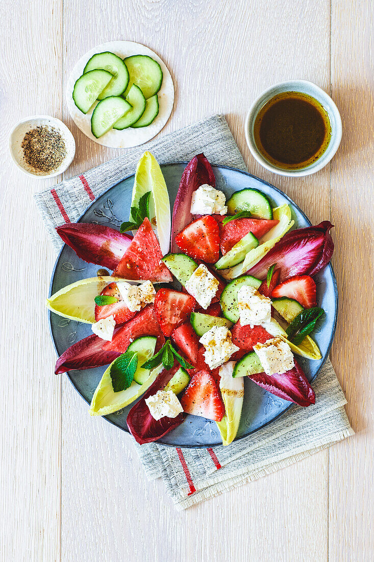 Chicory with watermelon, cucumber, and strawberries