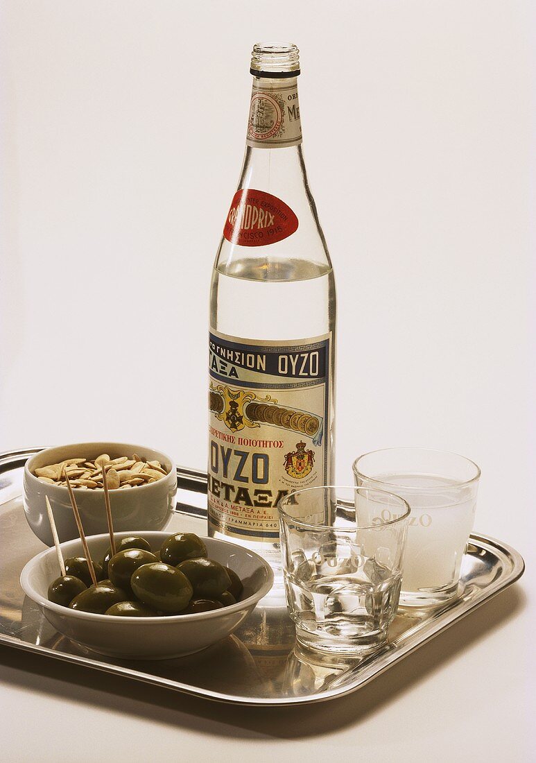 A Bottle of Ouzo; Anise Liqueur with Olives