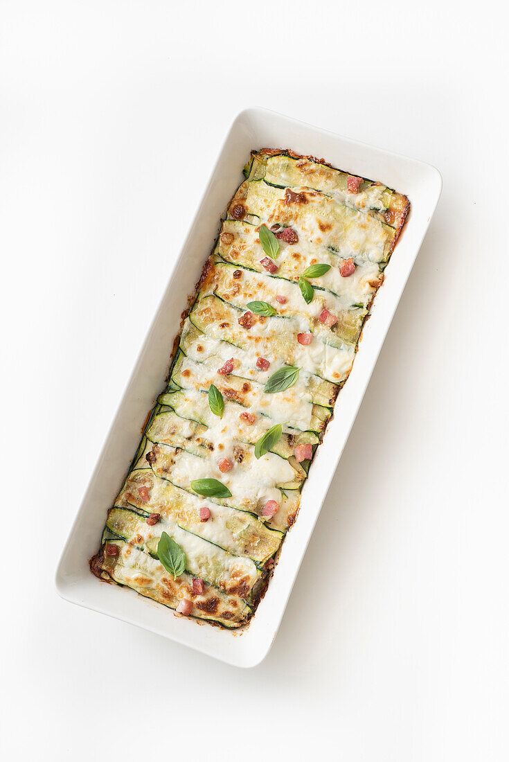 Zucchini parmigiana with potatoes, smoked bacon, and scamorza cheese