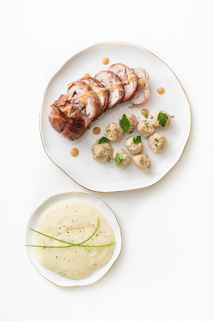 Rabbit roulade with bacon, dumplings, and creamed potatoes