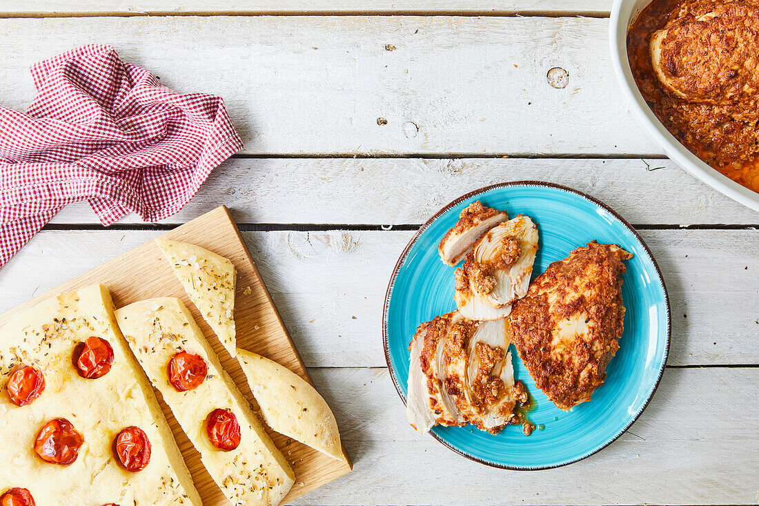 Chicken breast and focaccia with tomatoes