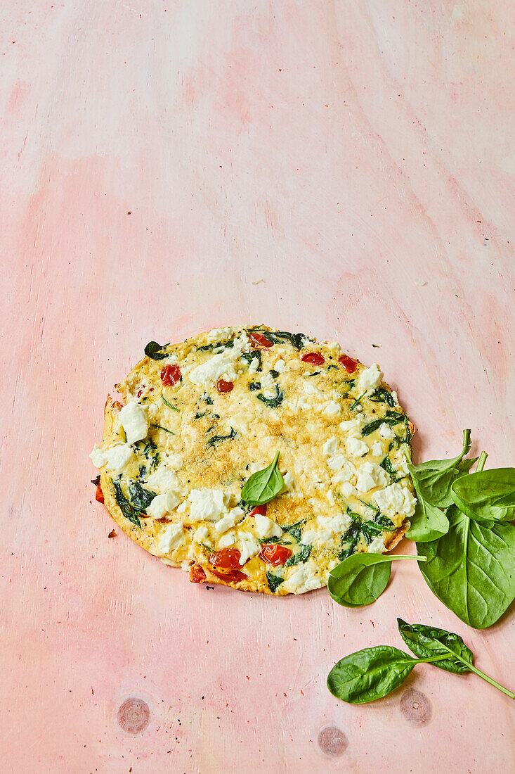 Omelette with feta cheese, spinach, and tomatoes