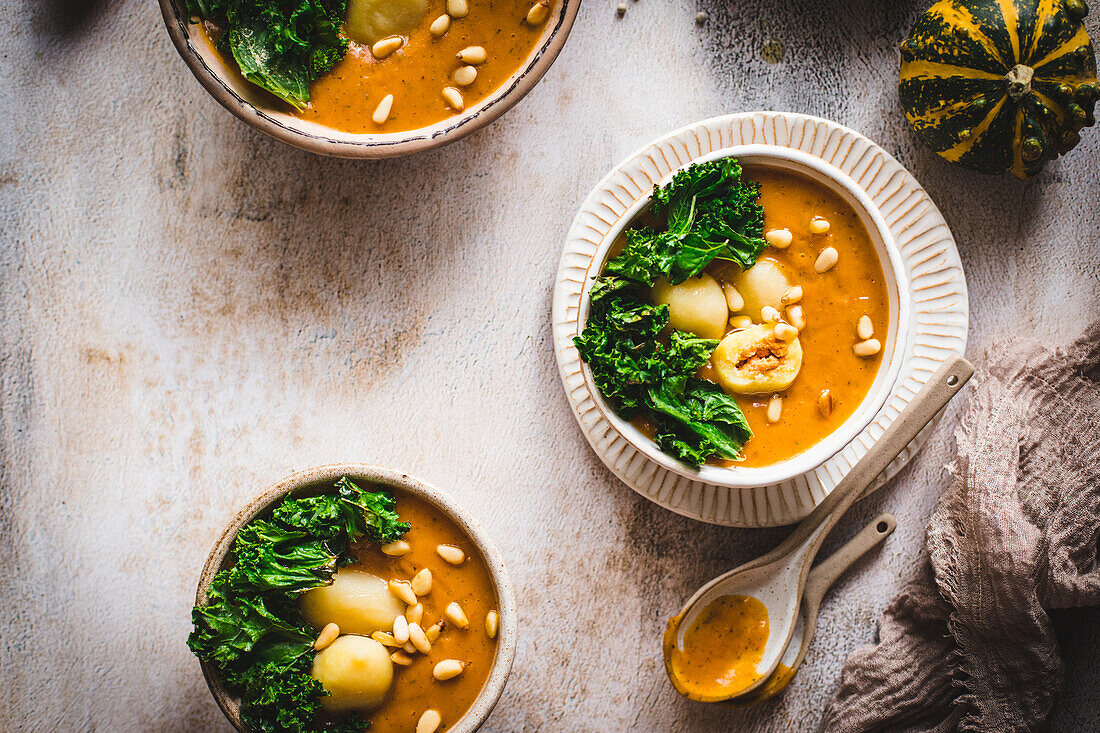 Pumpkin soup with kale and gnocchi