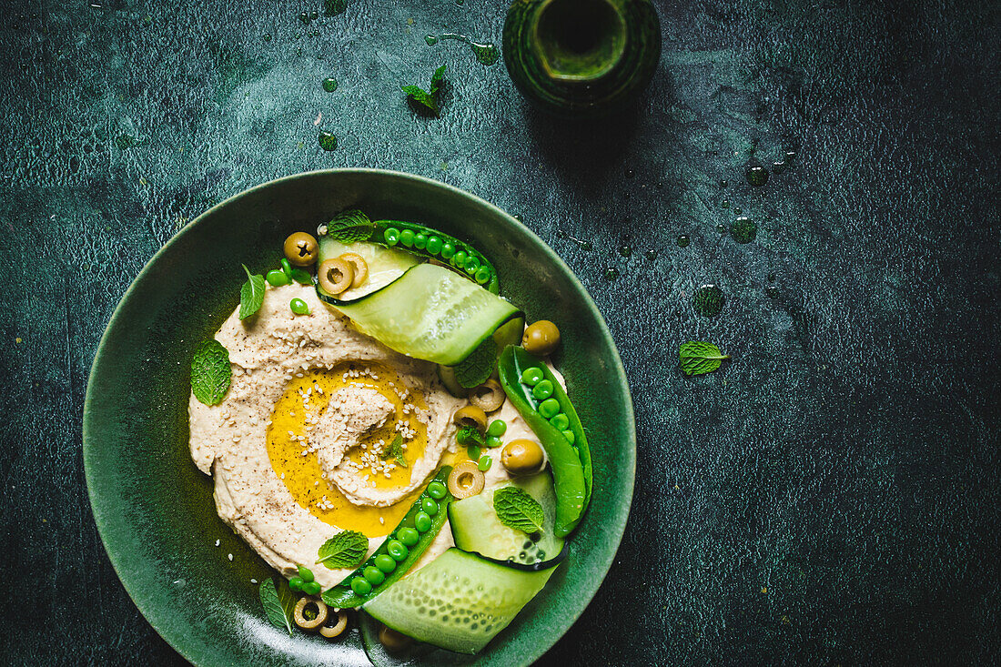 Hummus with cucumber and peas
