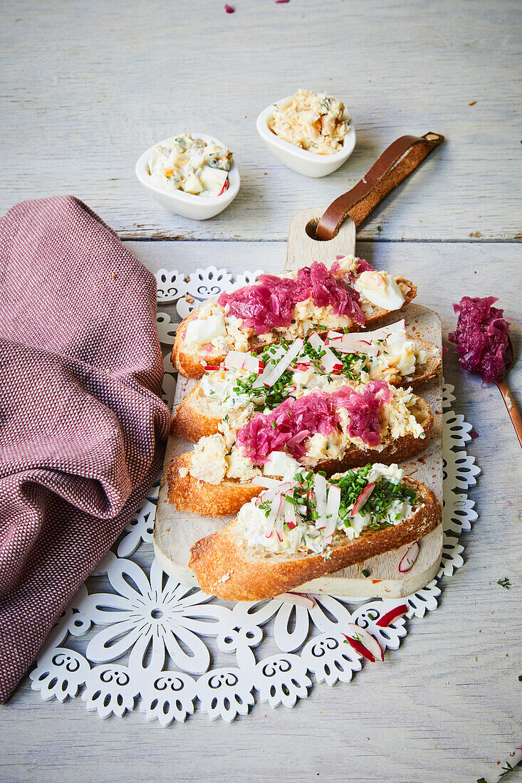 Open faced egg salad Sandwiches with radishes