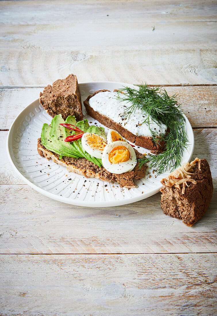 Avocado Toast with an egg and toast with cream cheese and dill