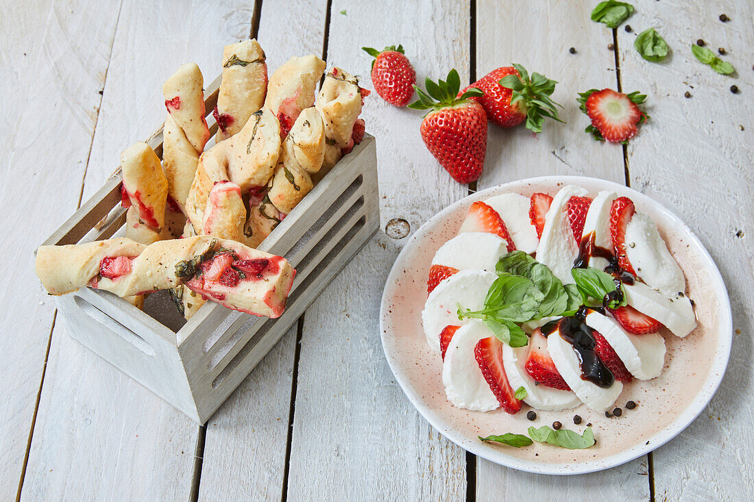 Puff pastry sticks with pistachios, basil, and strawberries and strawberry mozzarella salad