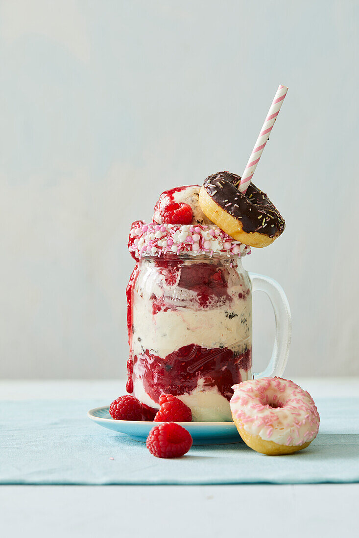 Freak Shake with mascapone cream, raspberries, and donuts