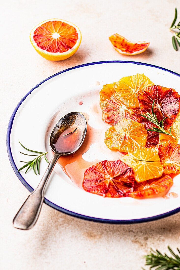 Blood orange salad with syrup and fresh rosemary
