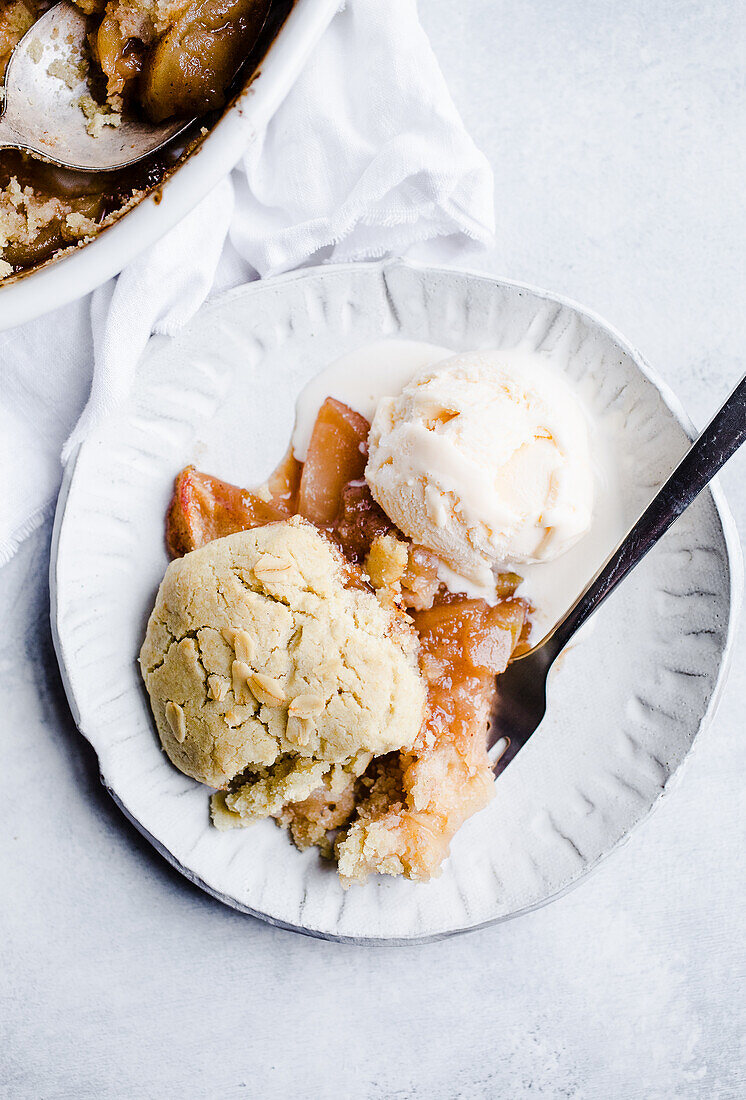 Baked apple cobbler with ice cream